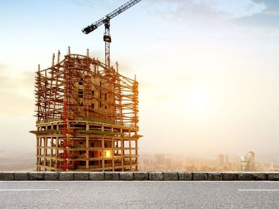 Building under construction at sunset