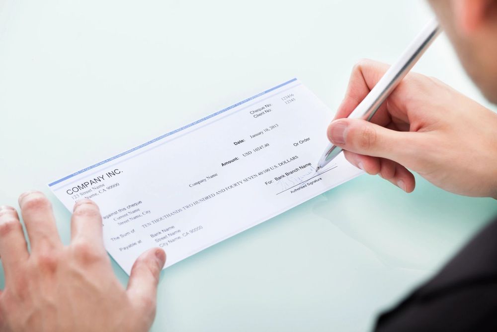 Signing a cheque